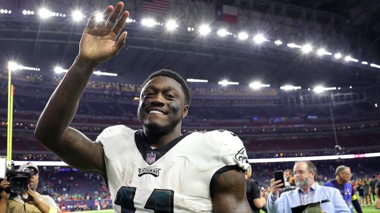 Philadelphia Eagles wide receiver A.J. Brown waves to fans after an NFL game amid Patriots trade speculation involving a future first-round pick.