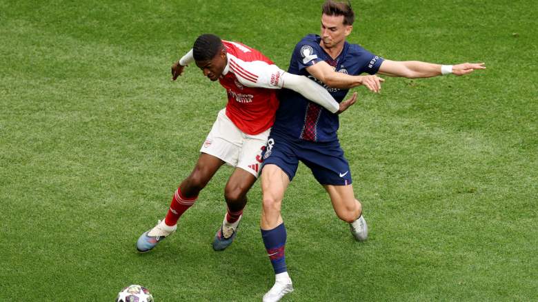 Cristhian Mosquera of Arsenal is challenged by Fabian Ruiz of PSG.