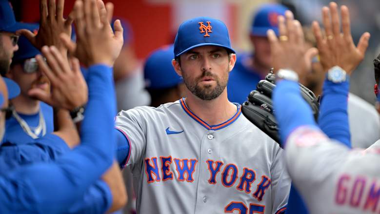 New York Mets starting pitcher Clay Holmes celebrates with his teammates in the dugout following his start against the Los Angeles Angels at Angel Stadium.