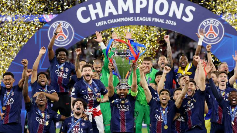Marquinhos of Paris Saint-Germain lifts the UEFA Champions League trophy.