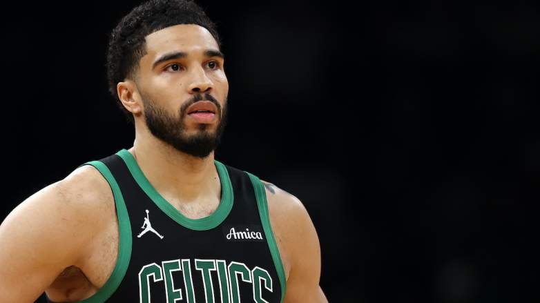 Boston Celtics star Jayson Tatum looks on during an NBA playoff game amid Game 7 injury concerns.