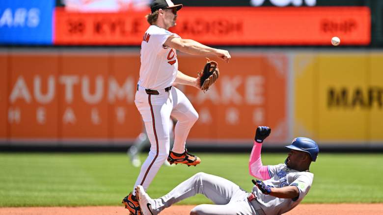 Gunnar Henderson #2 of the Baltimore Orioles throws to first base.