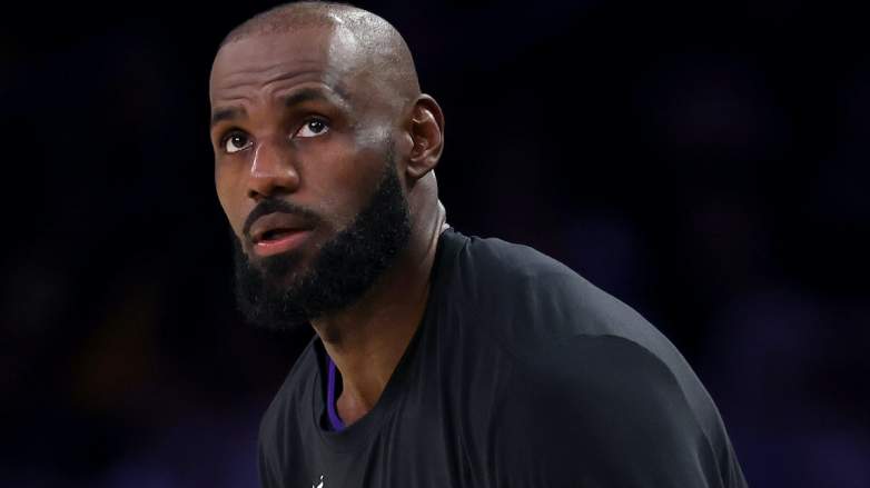 LeBron James looks on during a Los Angeles Lakers game amid speculation linking him to the Boston Celtics ahead of NBA free agency.