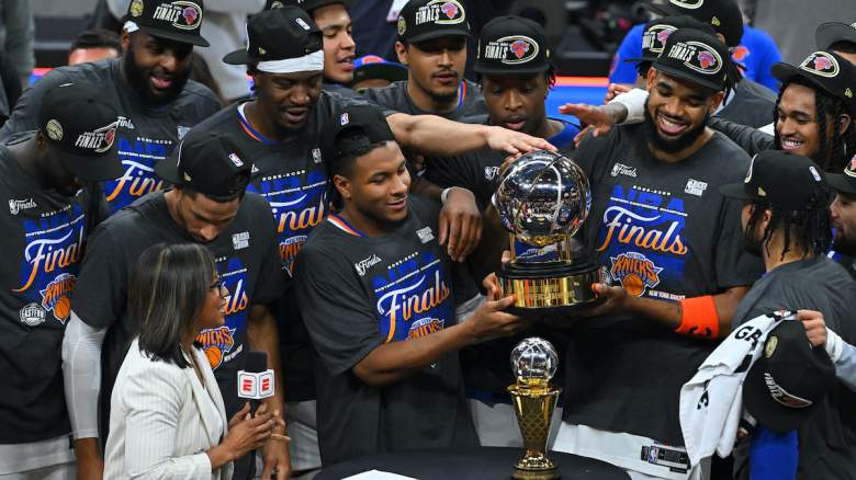 The New York Knicks celebrate with the Bob Cousy Trophy.