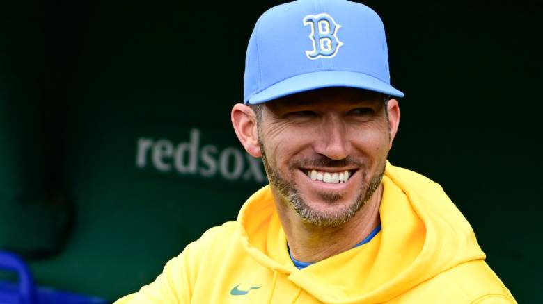 Red Sox interim manager Chad Tracy smiles in the dugout.