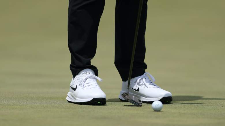Close-up of Rory McIlroy wearing special golf shoes during practice at Aronimink after suffering a ripped-off toenail and burst blister.