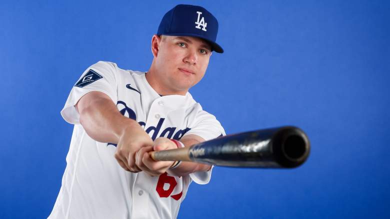 Los Angeles Dodgers first baseman Ryan Ward poses for a photo with a bat as part of photo day at Camelback Ranch in Glendale, Arizona.