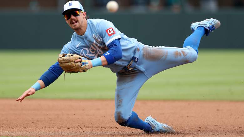 Bobby Witt Jr. dives for a ground ball during a game with the Kansas City Royals amid Yankees blockbuster trade speculation.