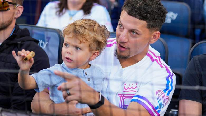 Quarterback Patrick Mahomes of the Kansas City Chiefs watches the action with son, Bronze, during the first inning between the Detroit Tigers and the Kansas City Royals at Kauffman Stadium on May 08, 2026