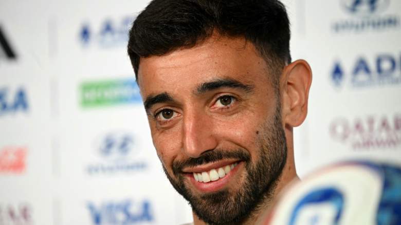 Portugal's midfielder #08 Bruno Fernandes smiles.