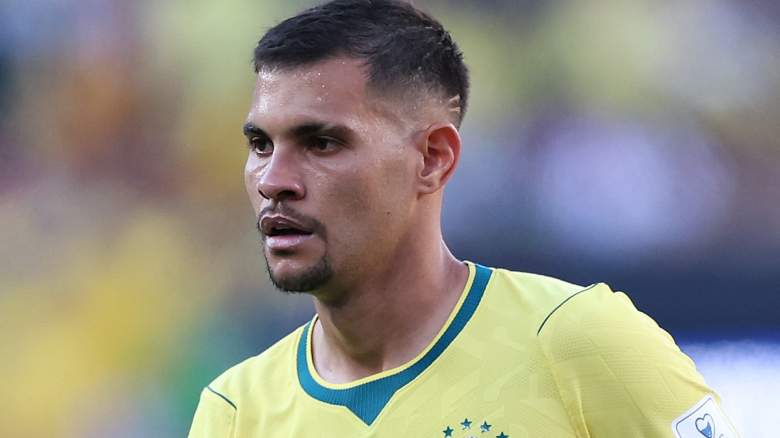Bruno Guimarães #8 of Brazil looks on.