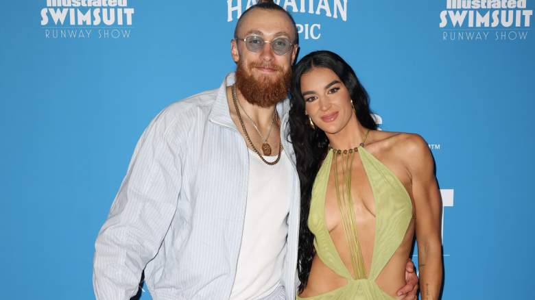 George Kittle and Claire Kittle pose for a photograph.