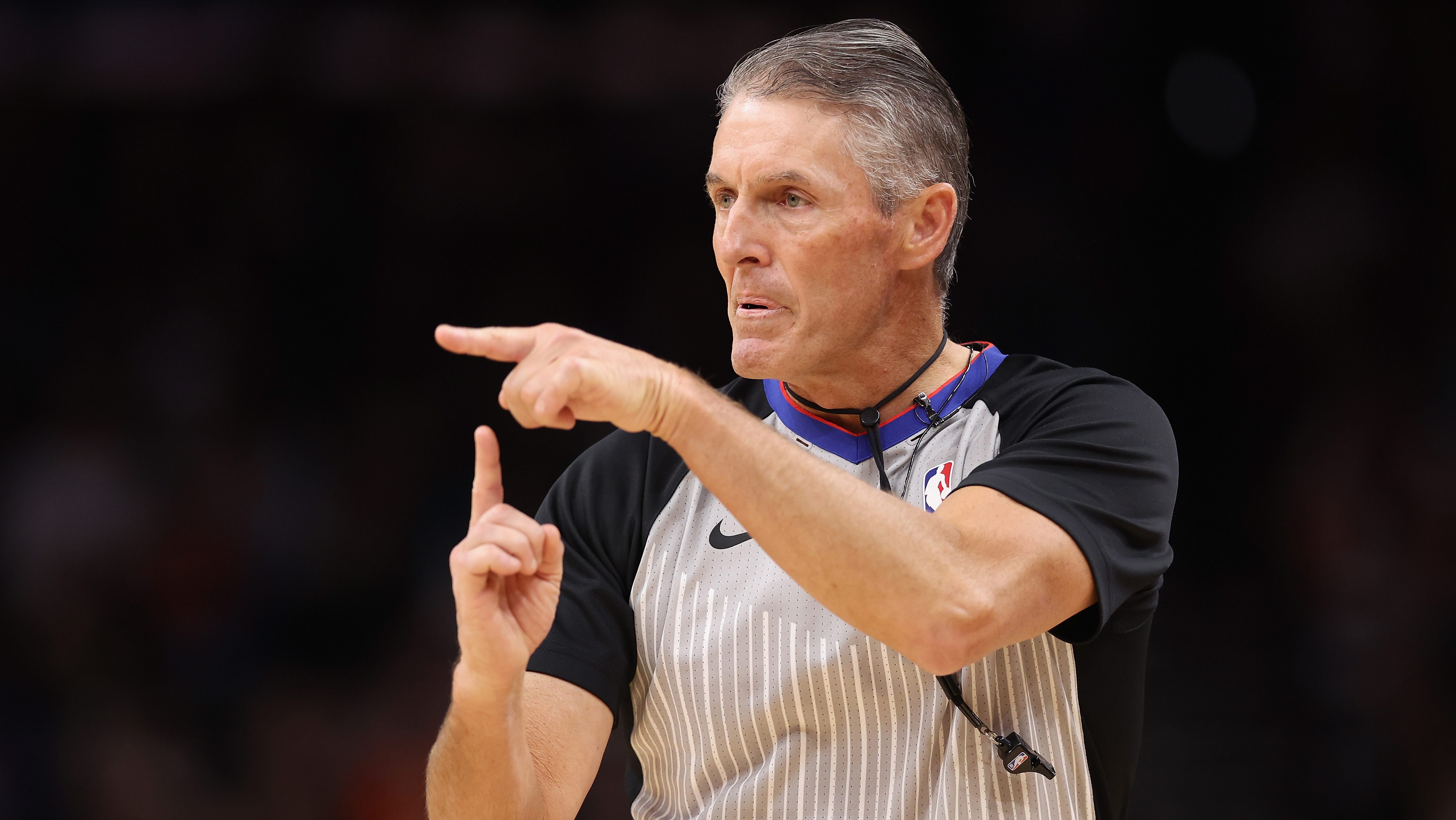 Veteran NBA referee Scott Foster points while making a call during an NBA game.