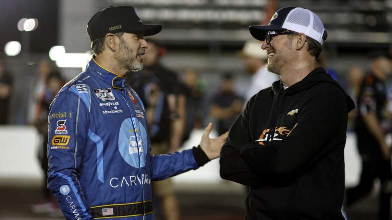 Dale Earnhardt Jr. talks with Jimmie Johnson before Daytona 500 qualifying at Daytona International Speedway.