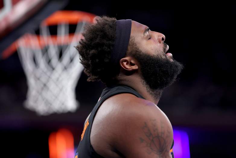 New York Knicks center Mitchell Robinson reacts during an NBA game as uncertainty surrounds his free agency.