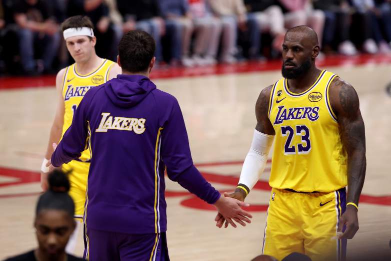 LeBron James #23, Austin Reaves #15, and Luka Doncic