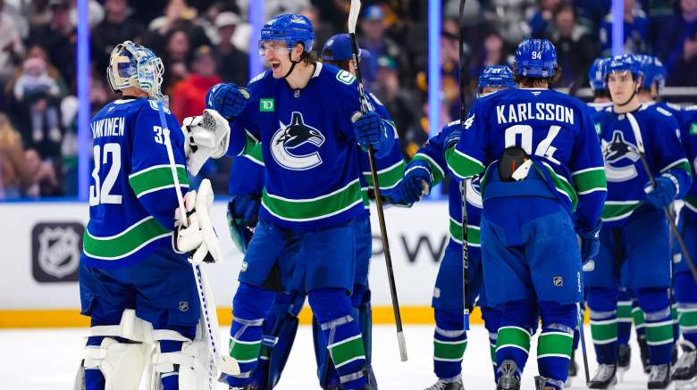 The Vancouver Canucks celebrate after defeating the Los Angeles Kings in overtime during their NHL game at Rogers Arena on April 14, 2026 in Vancouver, British Columbia, Canada.