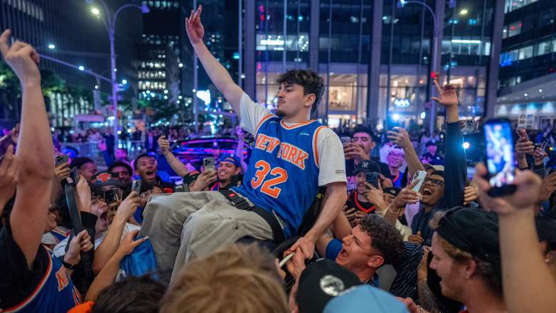 New York Knicks fans celebrate outside Madison Square Garden after the team clinched an NBA Finals berth.