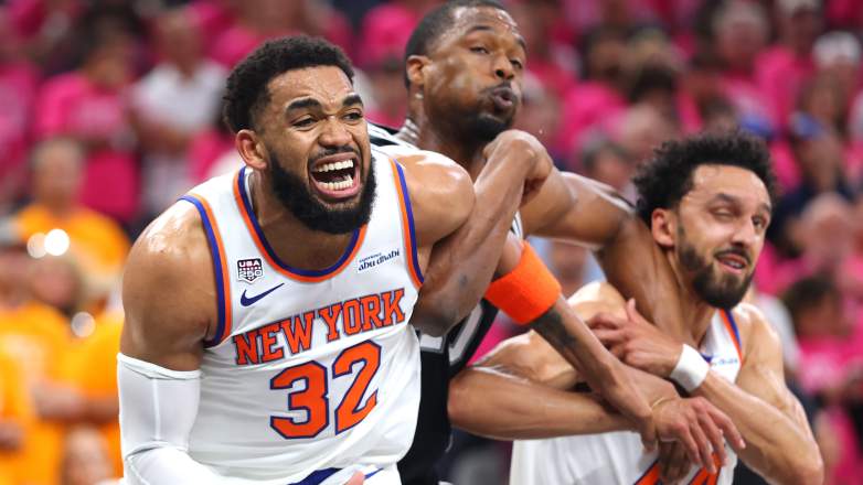 New York Knicks center Karl-Anthony Towns fights through contact while battling for position during an NBA Finals game against the San Antonio Spurs.