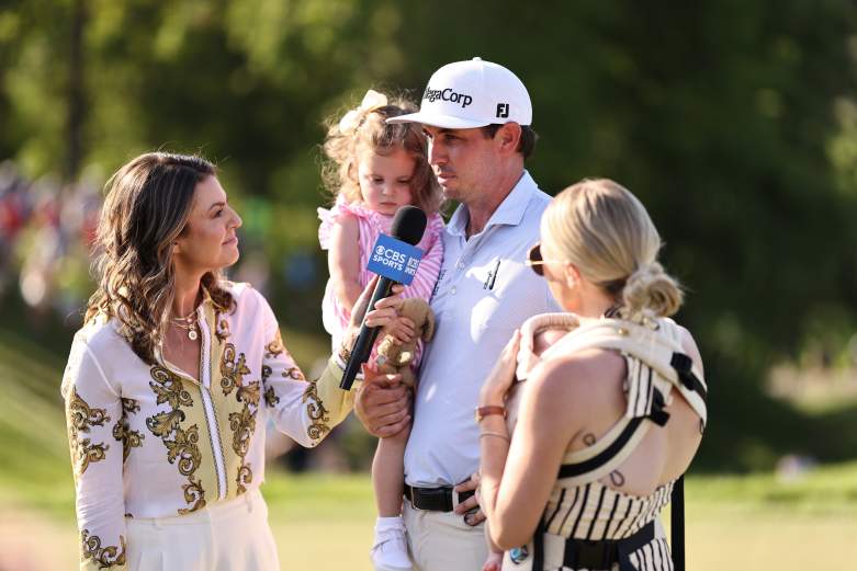 J.T. Poston of the United States and his wife Kelly and their daughters