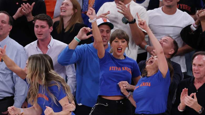 Taylor Swift celebrates during the New York Knicks' Game 4 victory over the San Antonio Spurs in the 2026 NBA Finals at Madison Square Garden while wearing a "Stevie Knicks" shirt.