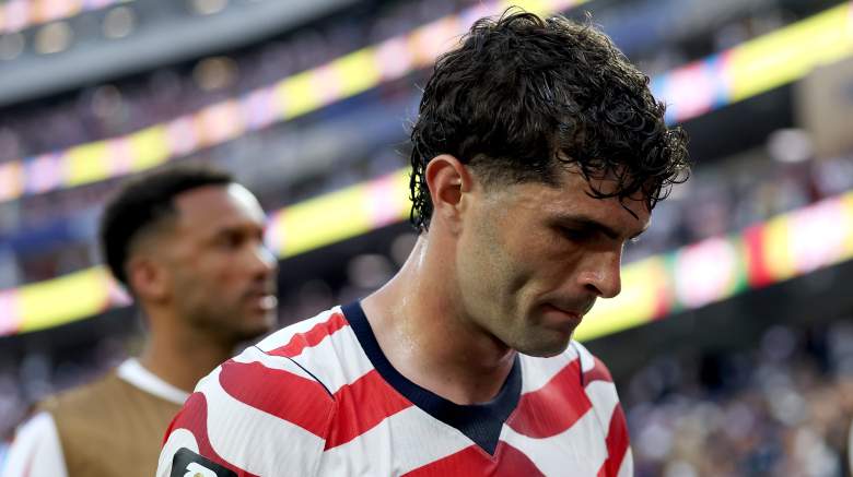 United States star Christian Pulisic walks off the field after aggravating his left calf injury during the FIFA World Cup, raising doubts about his availability against Australia.
