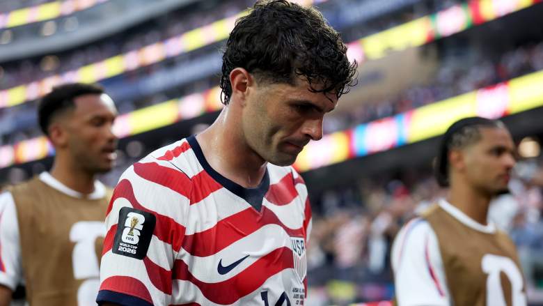 Christian Pulisic walks off the field after suffering a calf injury during the United States' World Cup match against Paraguay.