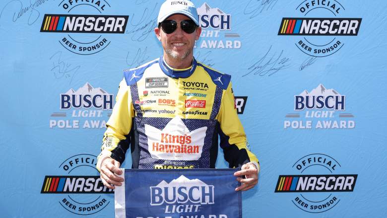 Denny Hamlin poses with the Busch Light Pole Award after qualifying at Pocono Raceway.