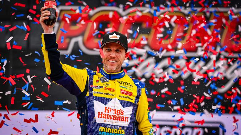 Denny Hamlin celebrates a NASCAR Cup Series victory at Pocono Raceway while discussing Corey Heim's first career Cup Series win.