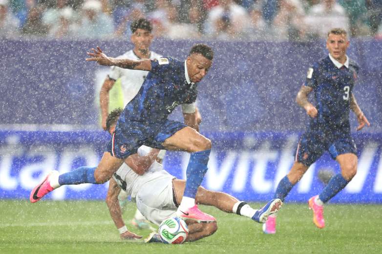Kylian Mbappe #10 of France is tackled by Hussein Ali #3 of Iraq during the FIFA World Cup 2026 Group I match between France and Iraq at Philadelphia Stadium on June 22, 2026 in Philadelphia, Pennsylvania.