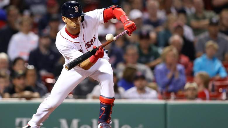Gorkys Hernandez #47 of the Boston Red Sox bunts.