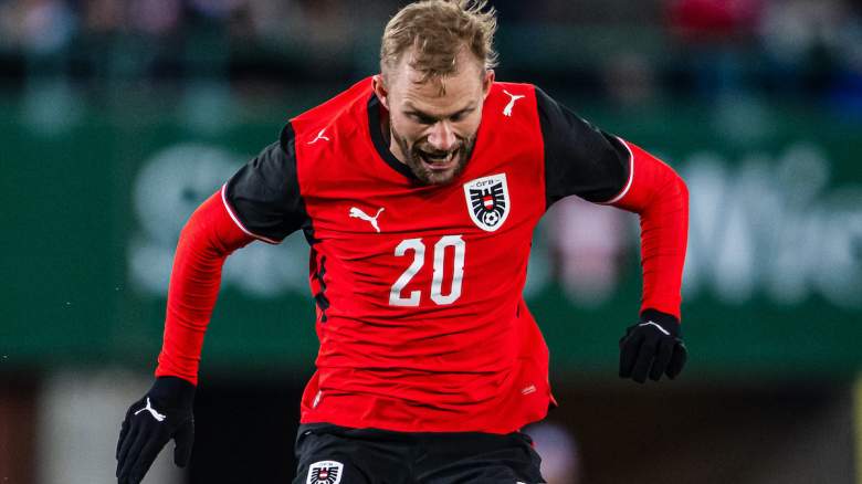 Konrad Laimer of Austria is tackled.