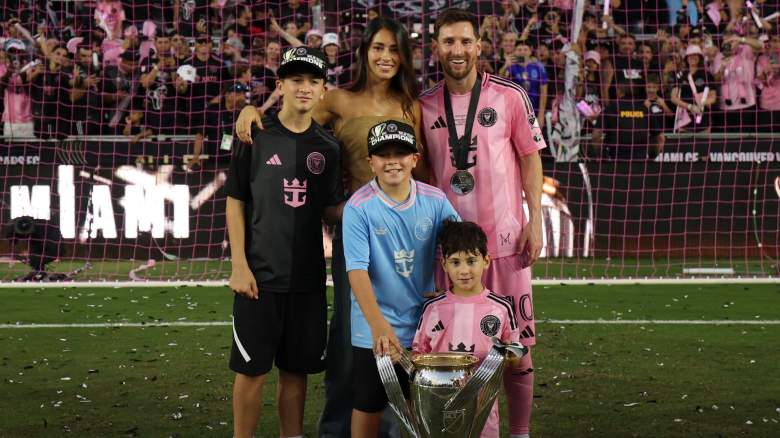 Lionel Messi #10 of Inter Miami CF with his family Antonella Rocuzzo, Thiago, Mateo and Ciro pose with the trophy after winning the Championship following the Audi 2025 MLS Cup Final match between Inter Miami CF and Vancouver Whitecaps FC at Chase Stadium on December 06, 2025 in Fort Lauderdale, Florida