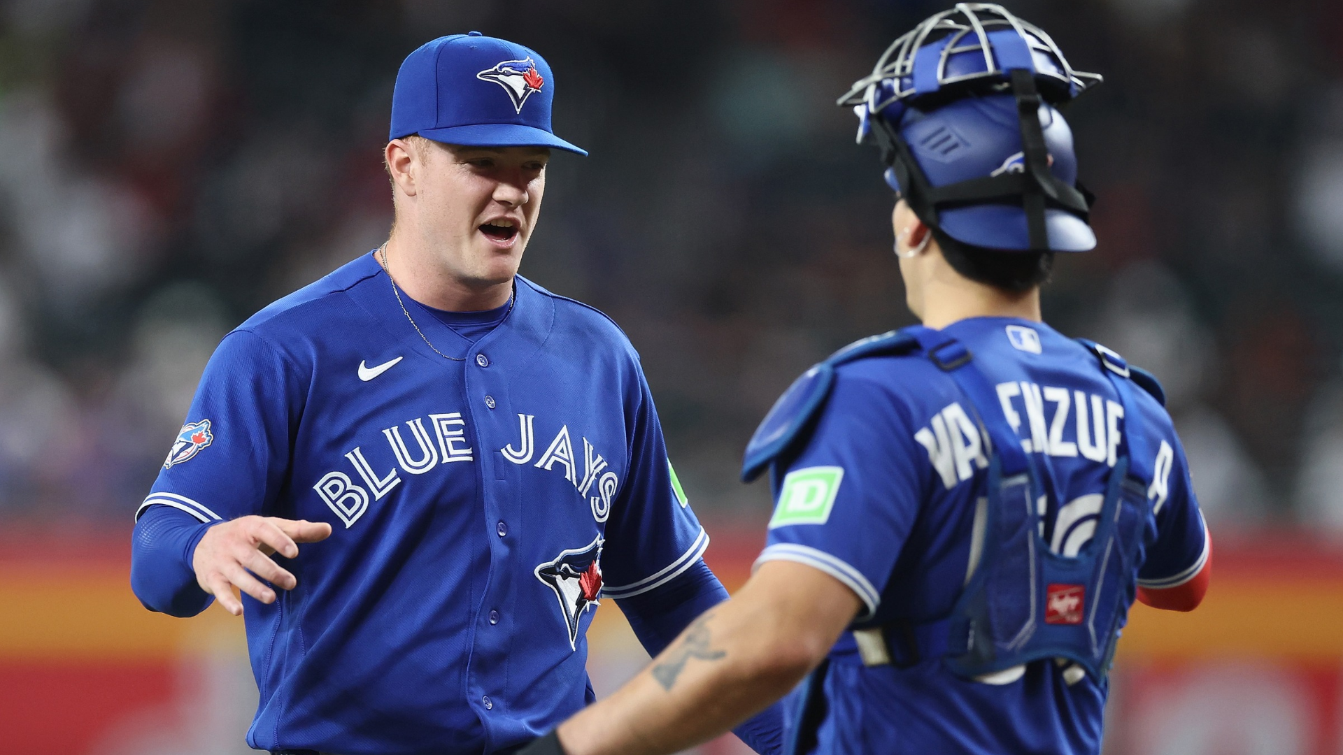 Relief pitcher Braydon Fisher #63 of the Toronto Blue Jays celebrates with Brandon Valenzuela #59 after defeating the Arizona Diamondbacks 10-4 in the MLB game at Chase Field on April 19, 2026 in Phoenix, Arizona. (Photo by Christian Petersen/Getty Images)