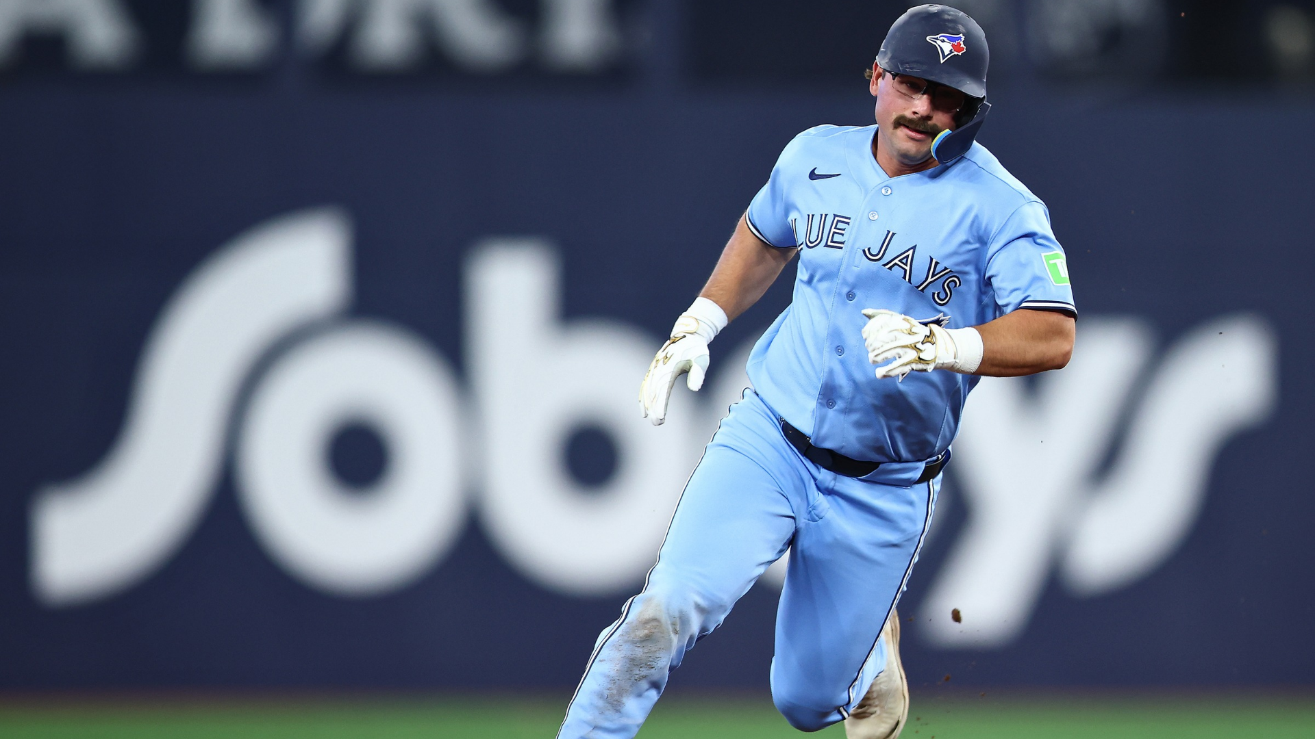 Davis Schneider #36 of the Toronto Blue Jays runs to third base on a single by Andres Gimenez #0 in the eighth inning of a game against the Los Angeles Dodgers at Rogers Centre on April 8, 2026 in Toronto, Ontario, Canada. (Photo by Vaughn Ridley/Getty Images)