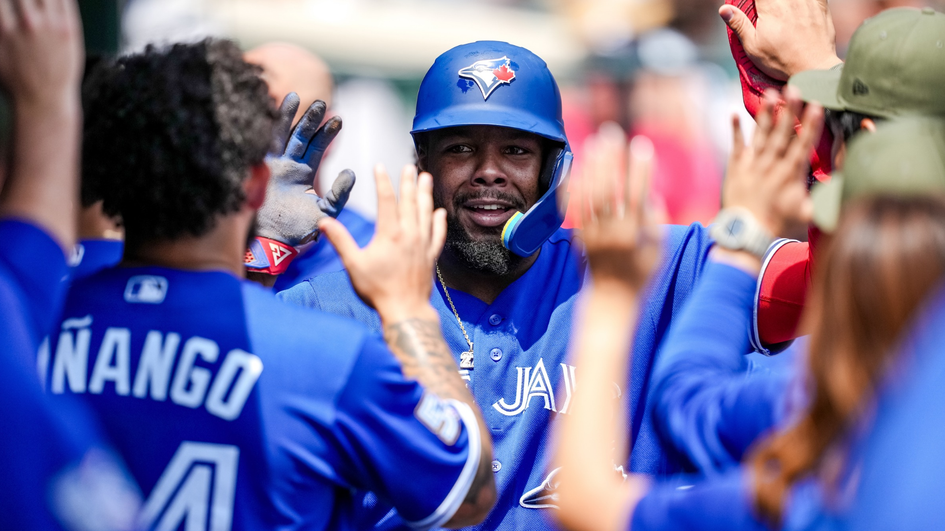 Vladimir Guerrero Jr. #27 of the Toronto Blue Jays high fives teammates after scoring a run against the Detroit Tigers during the top of the third inning at Comerica Park on May 17, 2026 in Detroit, Michigan. (Photo by Nic Antaya/Getty Images)