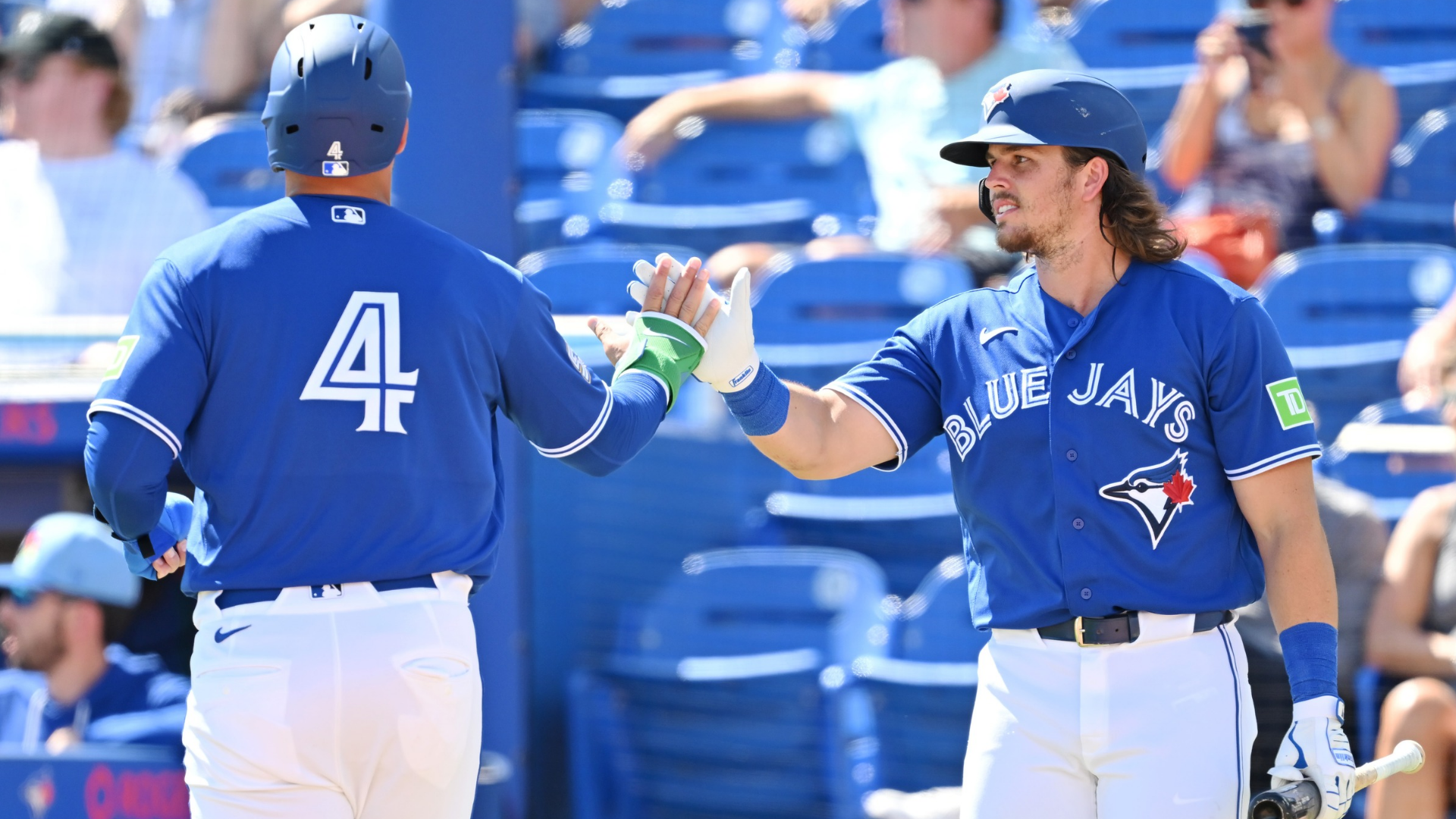 George Springer #4 high-fives teammate Addison Barger #47 of the Toronto Blue Jays after scoring in the second inning against team Canada during a game at TD Ballpark on March 03, 2026 in Dunedin, Florida. (Photo by Julio Aguilar/Getty Images)