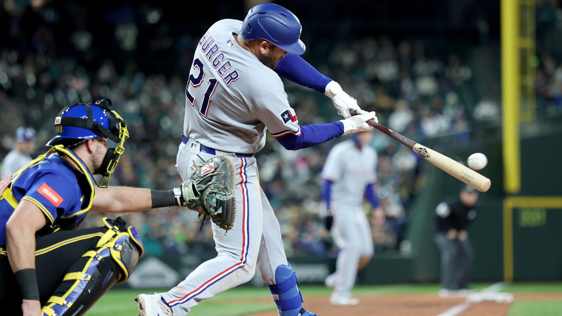 Jake Burger #21 of the Texas Rangers hits an RBI single during the seventh inning against the Seattle Mariners at T-Mobile Park on April 17, 2026 in Seattle, Washington. (Photo by Steph Chambers/Getty Images)