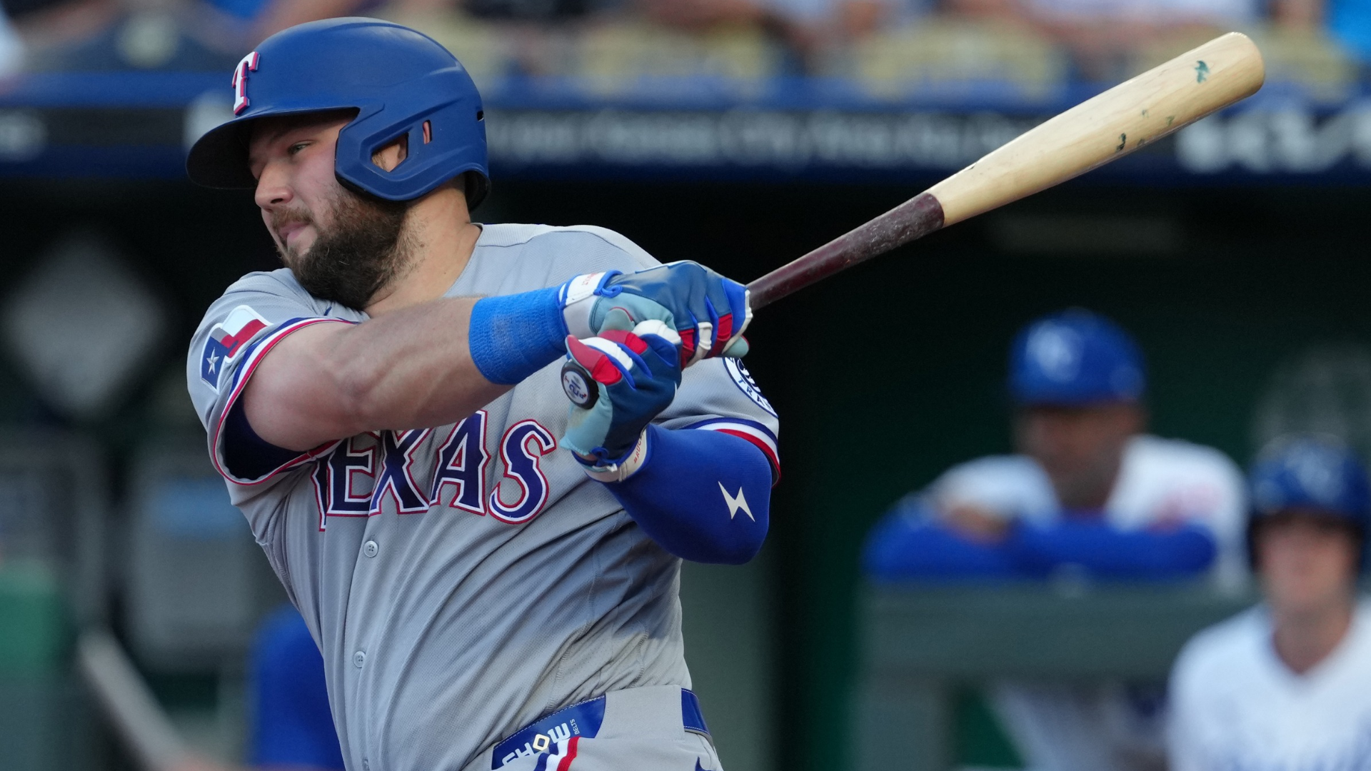 Jake Burger #21 of the Texas Rangers hits an RBI single against the Kansas City Royals in the second inning at Kauffman Stadium on June 09, 2026 in Kansas City, Missouri. (Photo by Ed Zurga/Getty Images)