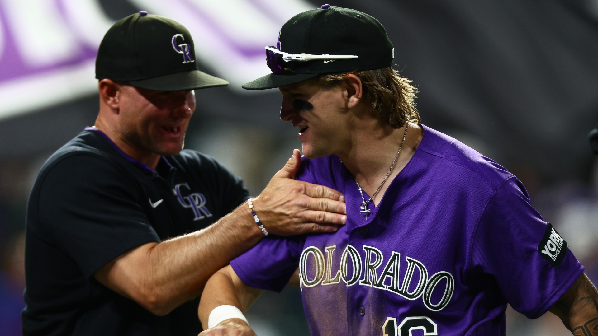Cole Carrigg #16 of the Colorado Rockies is congratulated by manager Warren Schaeffer after their 7-3 win against the Chicago Cubs at Coors Field on June 9, 2026 in Denver, Colorado. (Photo by Justin Edmonds/Getty Images)