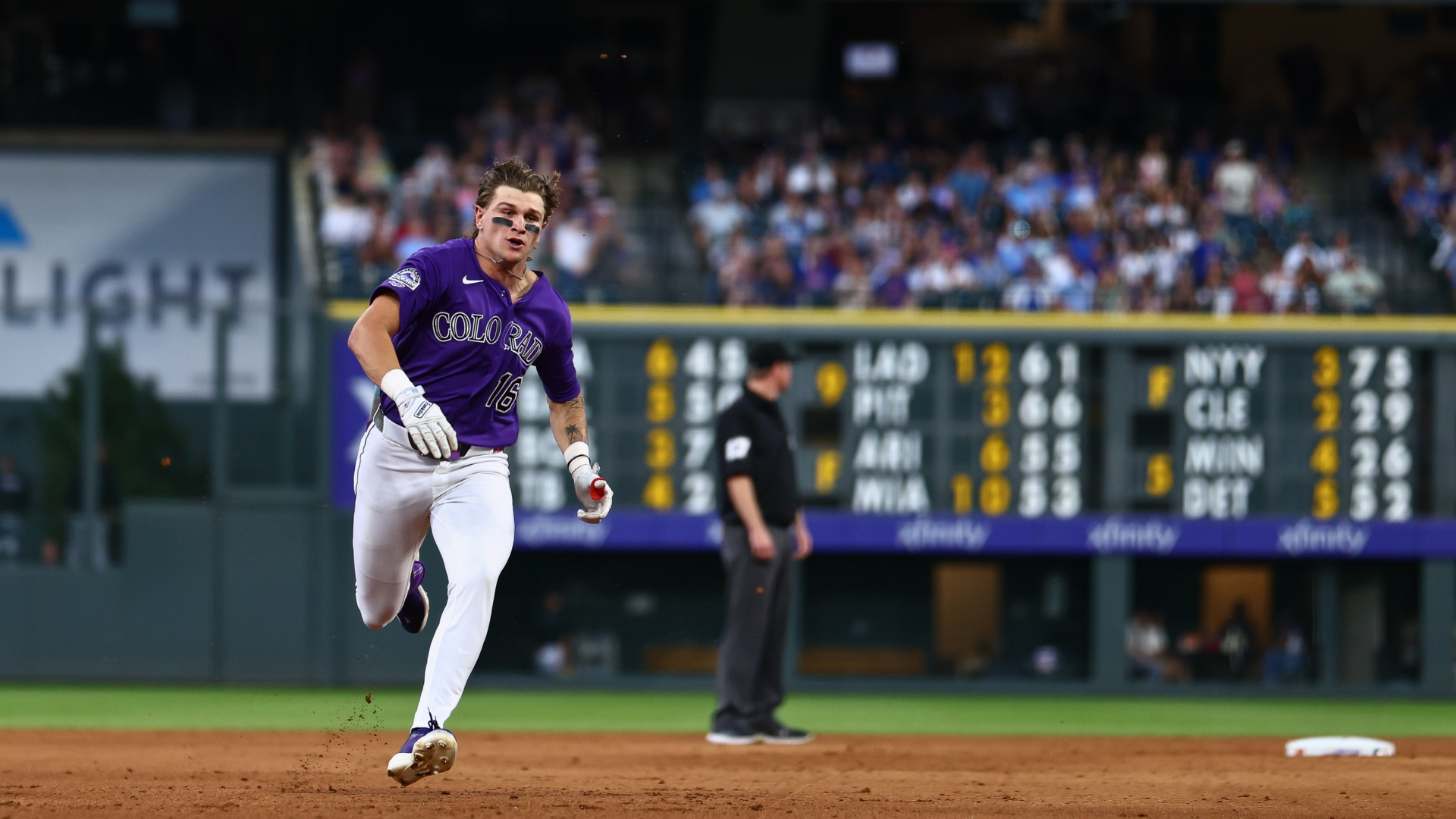 Cole Carrigg #16 of the Colorado Rockies runs to third base with a triple in the fifth inning against the Chicago Cubs at Coors Field on June 9, 2026 in Denver, Colorado. Carrigg earned his first hit on the play in his Major League debut. (Photo by Justin Edmonds/Getty Images)
