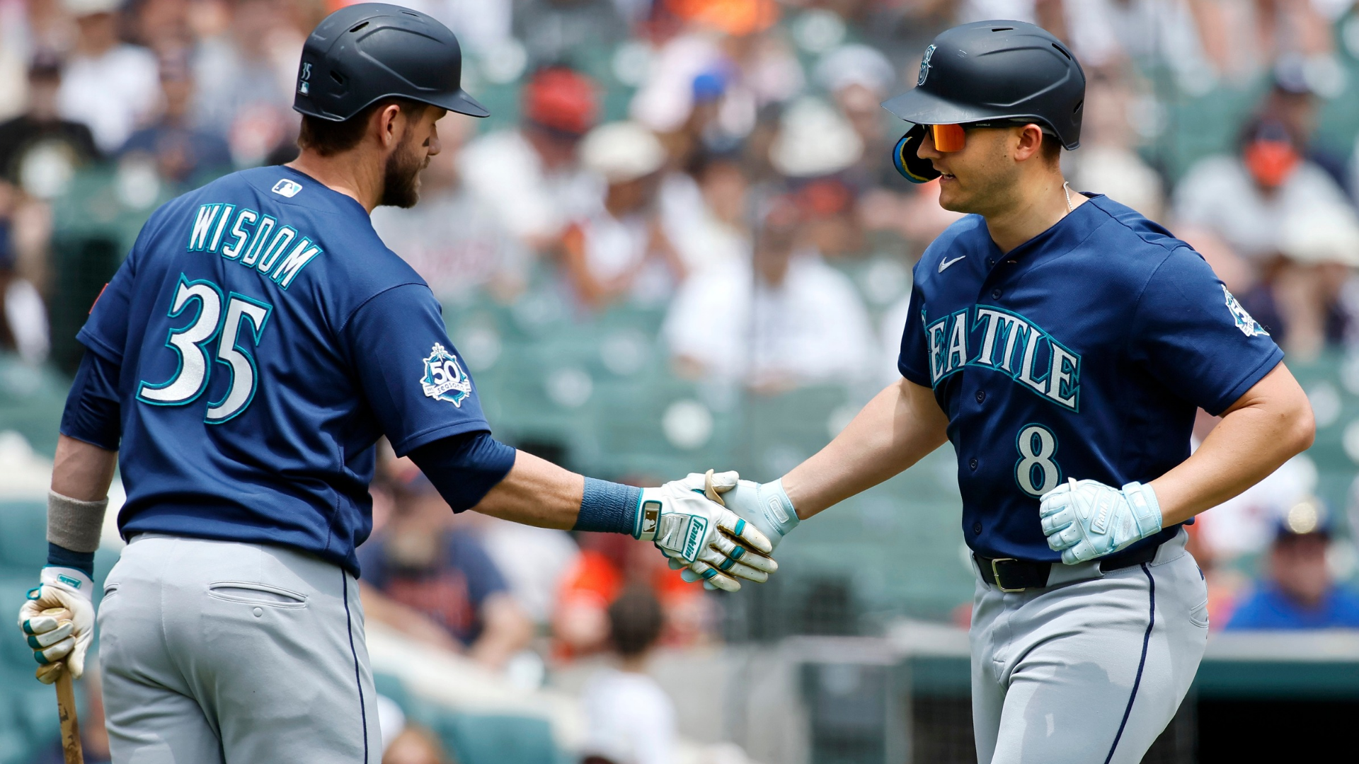 Dominic Canzone #8 of the Seattle Mariners celebrates with Patrick Wisdom #35 after hitting a solo home run against the Detroit Tigers during the fourth inning at Comerica Park on June 6, 2026 in Detroit, Michigan. (Photo by Duane Burleson/Getty Images)
