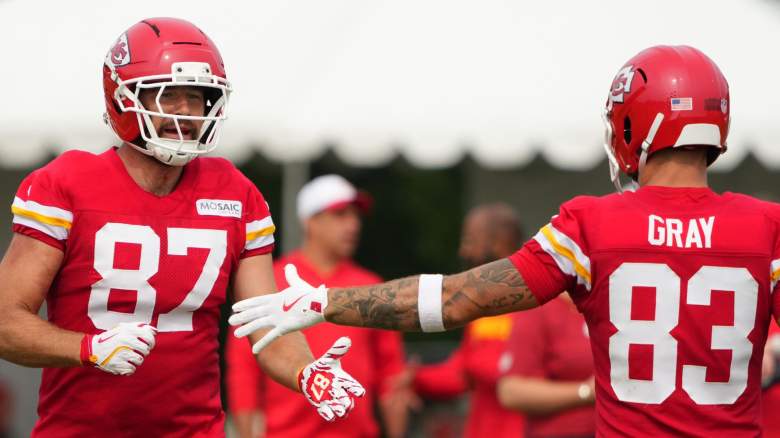 Travis Kelce #87 of the Kansas City Chiefs slaps hands with Noah Gray #83 of the Kansas City Chiefs during training camp at Missouri Western State University on August 03, 2025