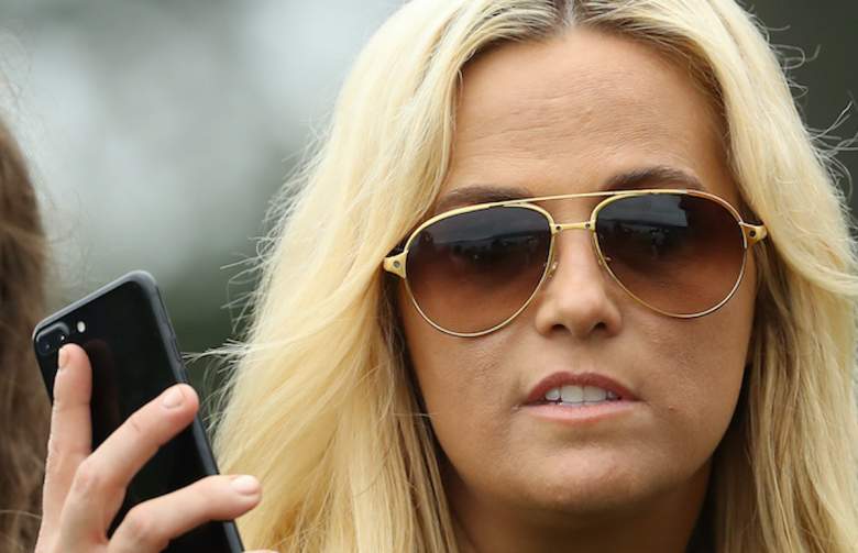 Amy Mickelson, wife of Phil Mickelson of the United States, looks on.
