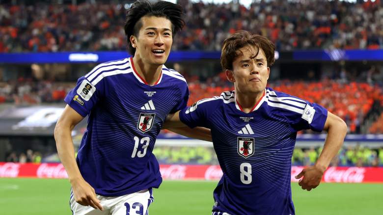 Keito Nakamura #13 of Japan celebrates with Takefusa Kubo #8.