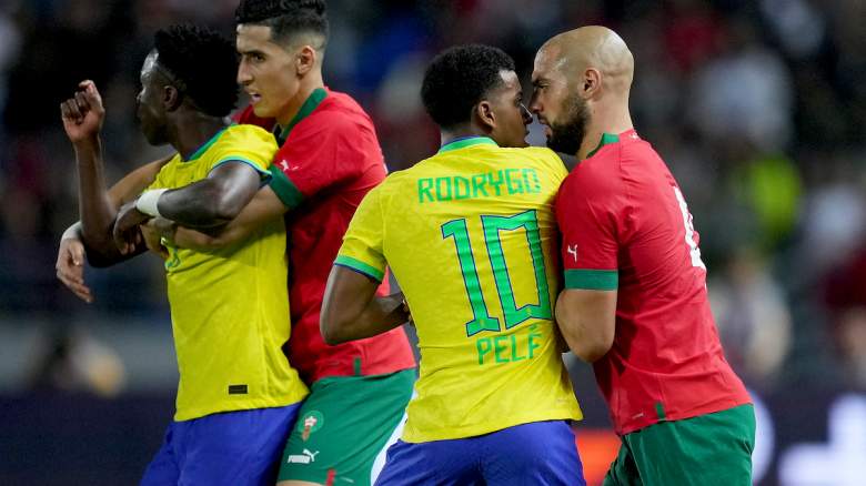 Rodrygo of Brazil argues with Sofyan Amrabat of Morocco.