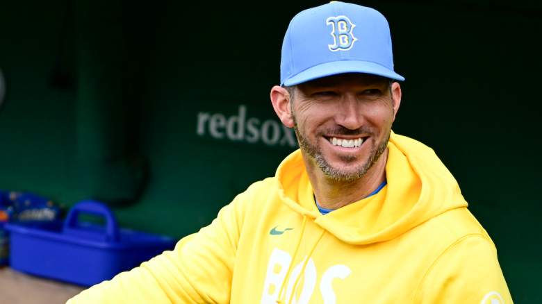 Boston Red Sox interim manager Chad Tracy smiles in the dugout as the club weighs whether to promote reliever Tommy Kahnle.