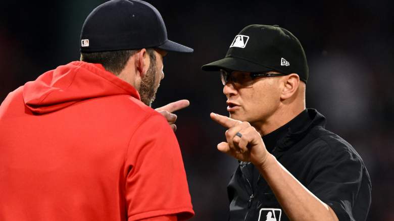 Manager Chad Tracy #17 of the Boston Red Sox argues with umpire Vic Carapazza.