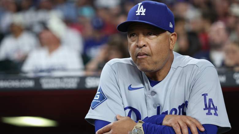 Los Angeles Dodgers manager Dave Roberts watches from the dugout before a game during the 2026 MLB season.