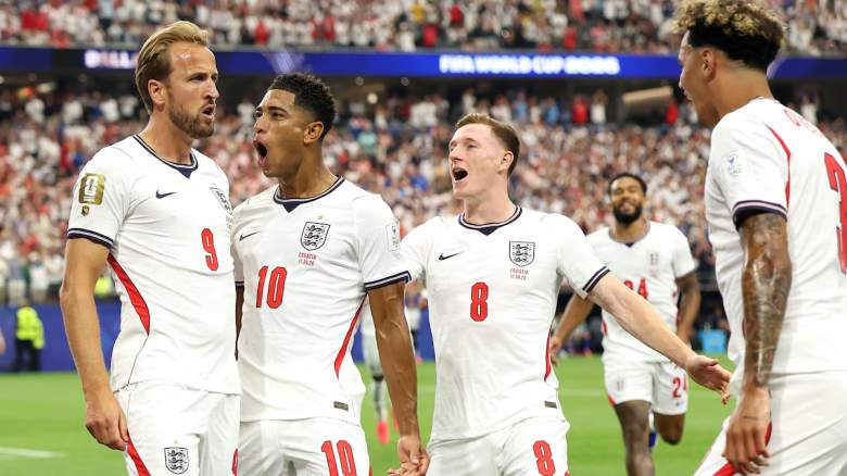 Harry Kane #9 of England celebrates with teammates.